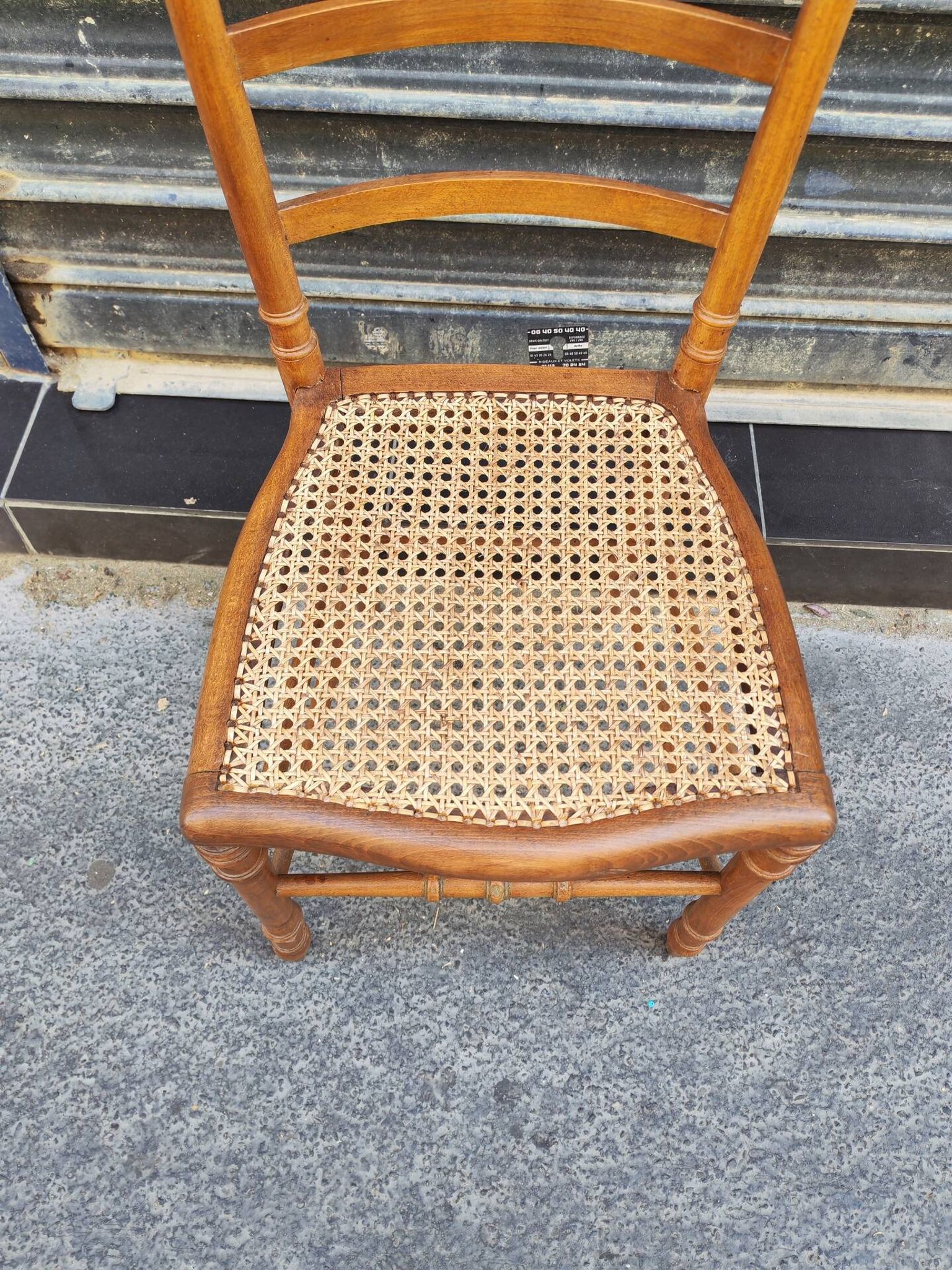 Antique wooden chair with cane seating