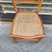 Antique wooden chair with cane seating