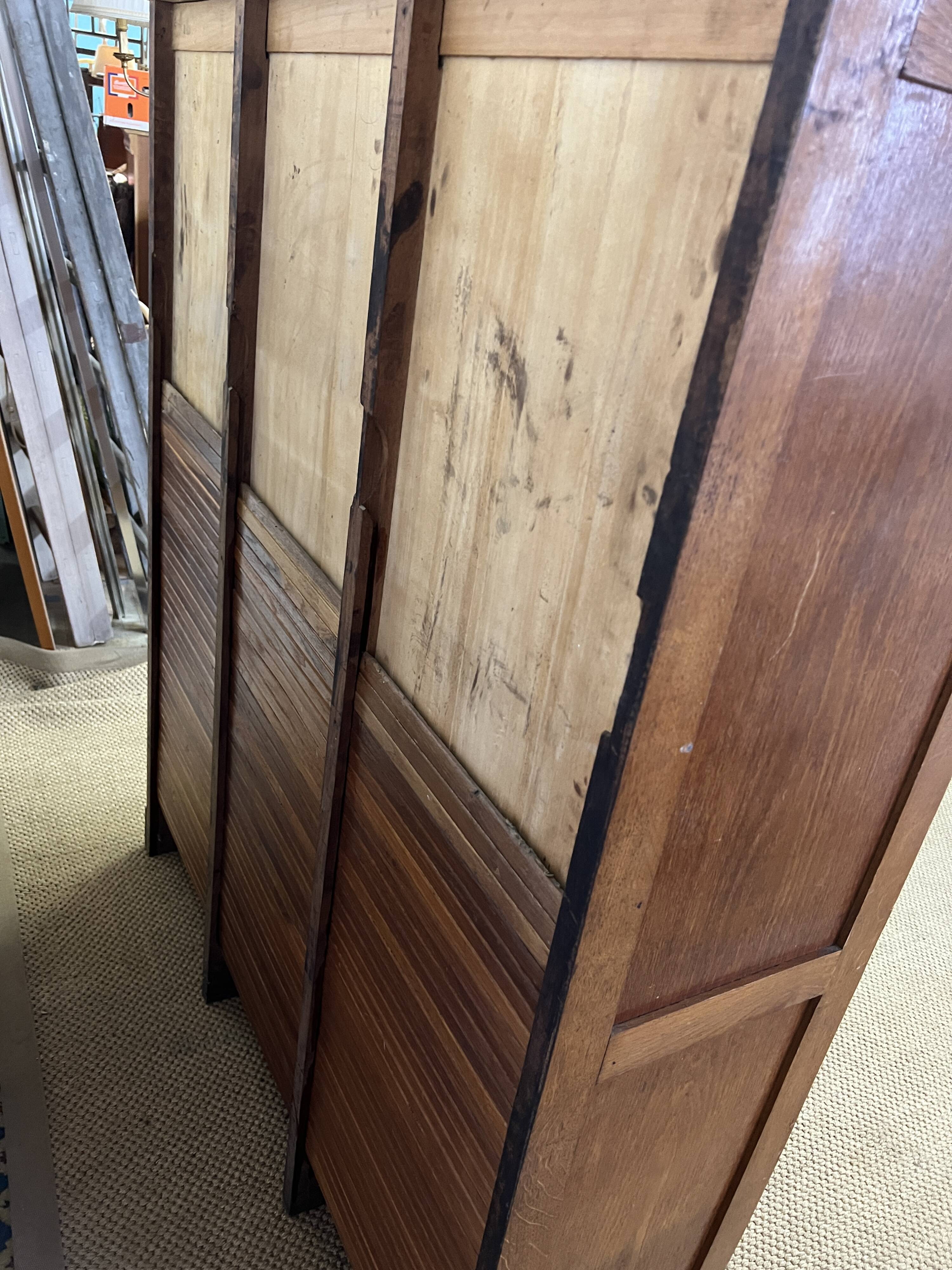 Old filing cabinet with triple curtains