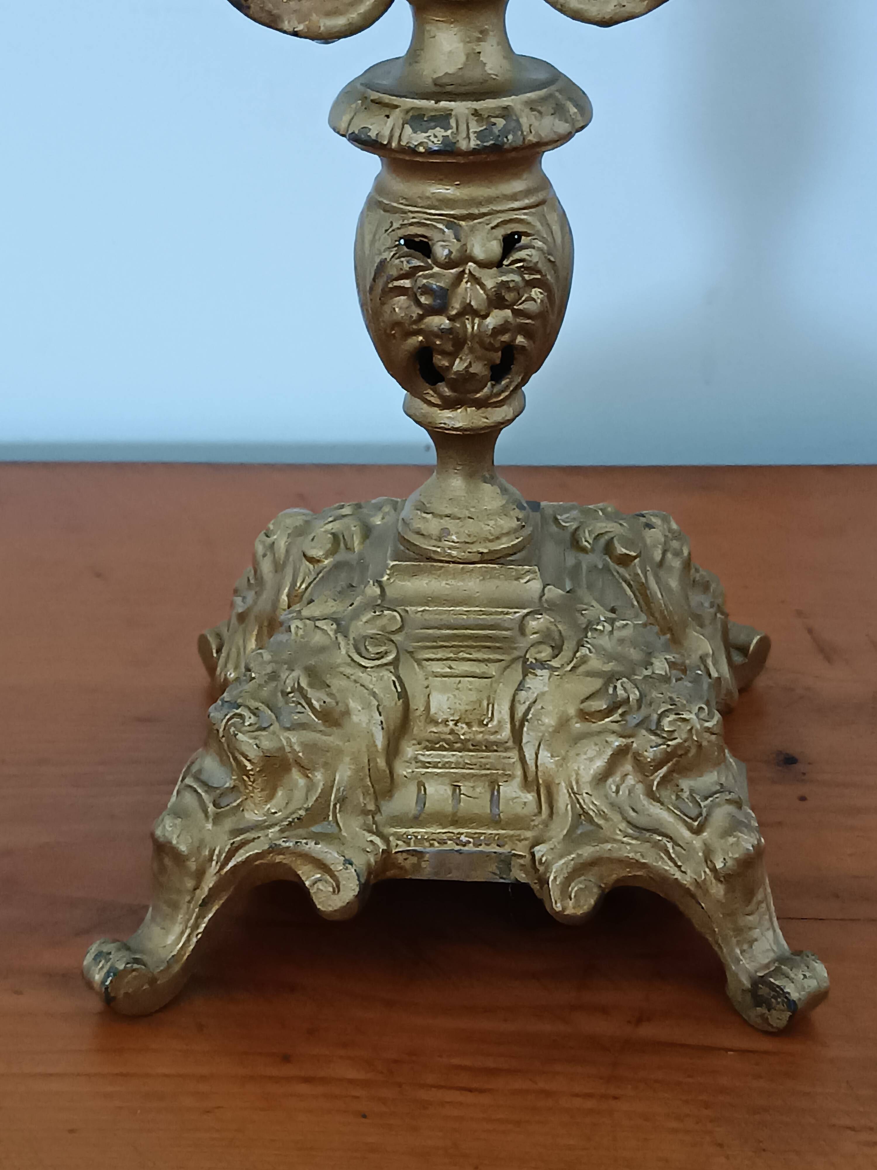 Bronze candlestick with lion head decoration