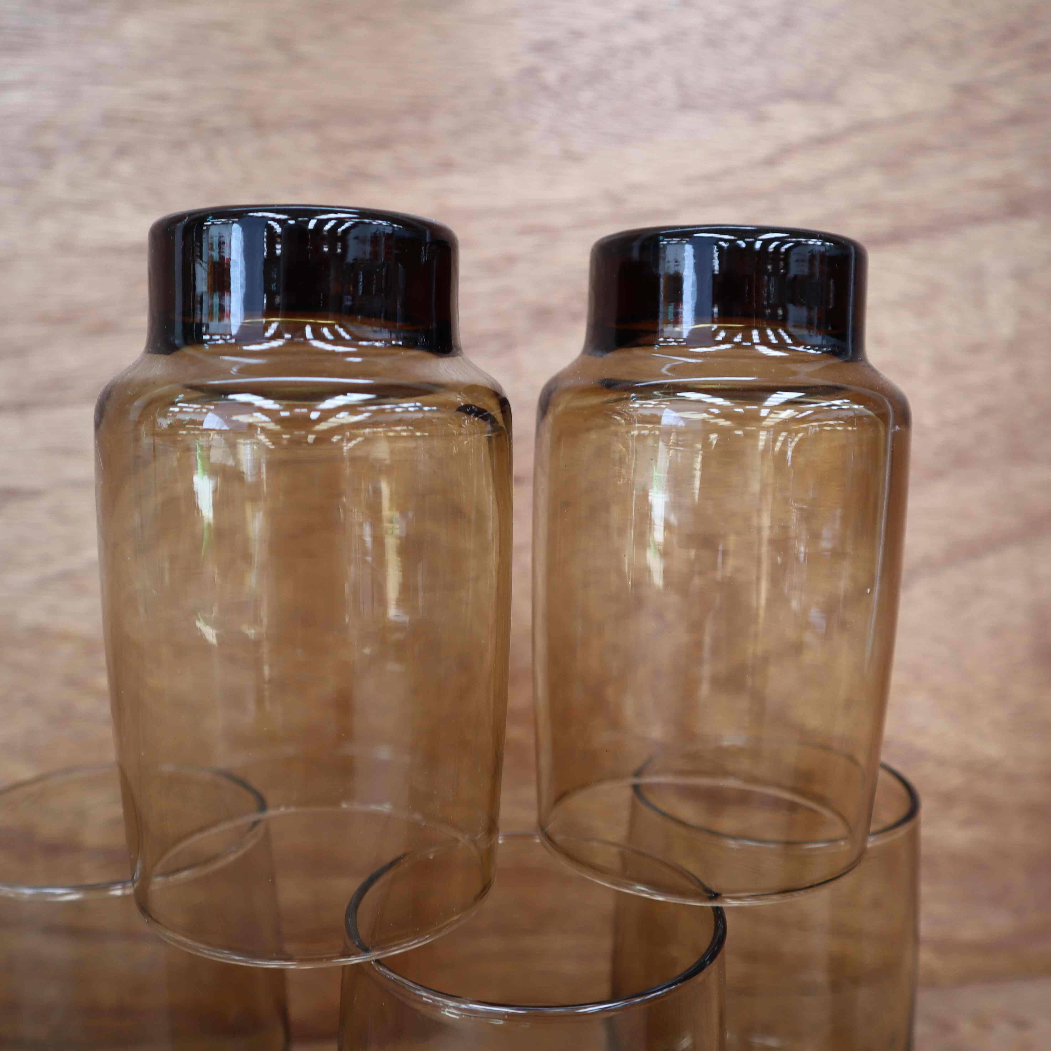 6 Smoked glasses with thick legs from the 70s
