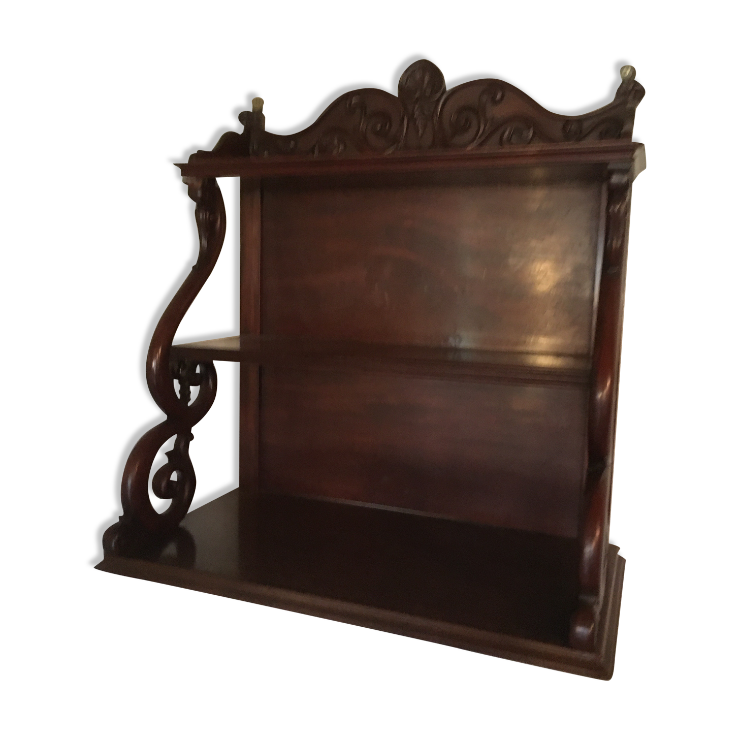 Carved wooden wall shelf.