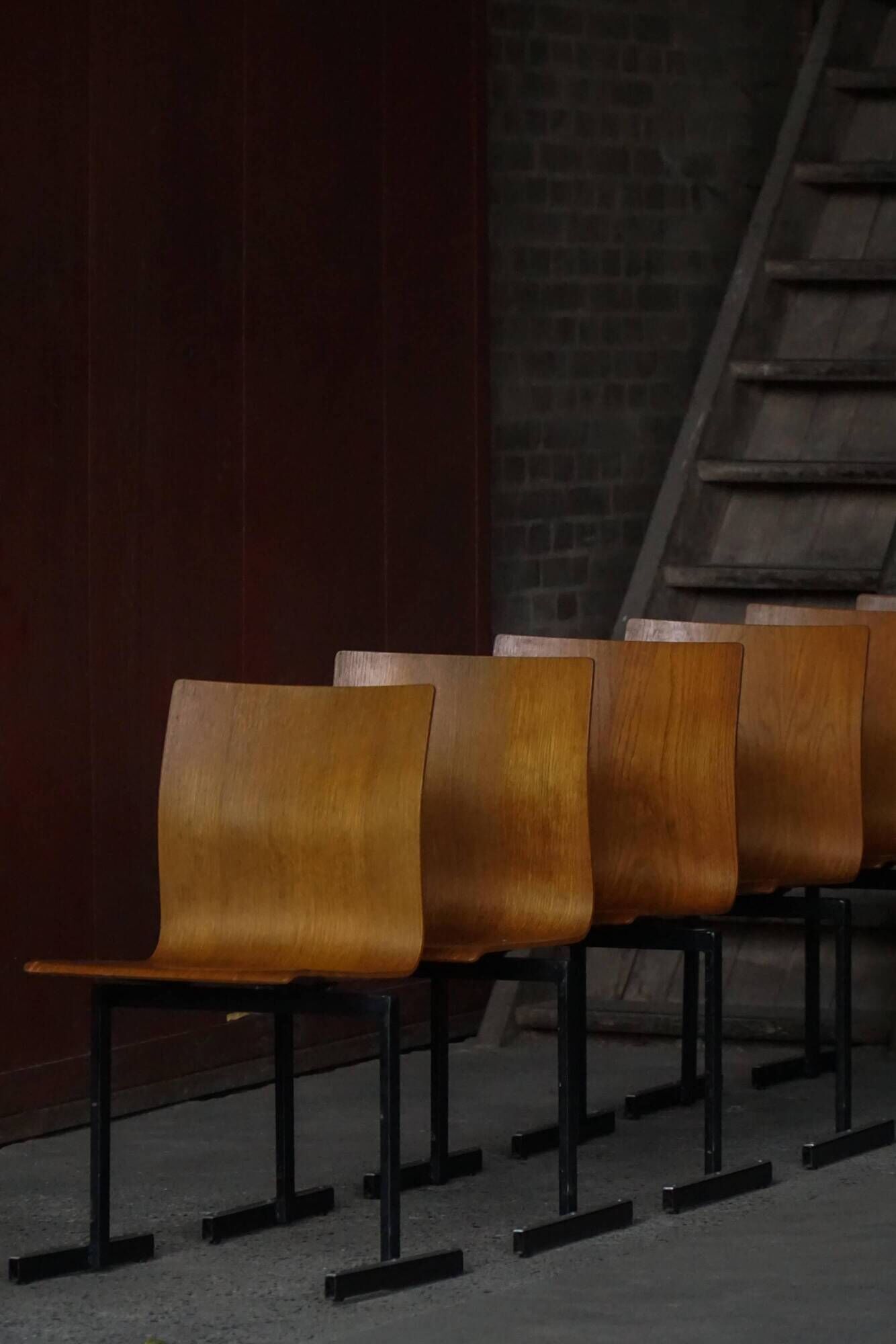 Set of 6 stackable industrial chairs by Niels Larsen, black metal and oak, 1960s.