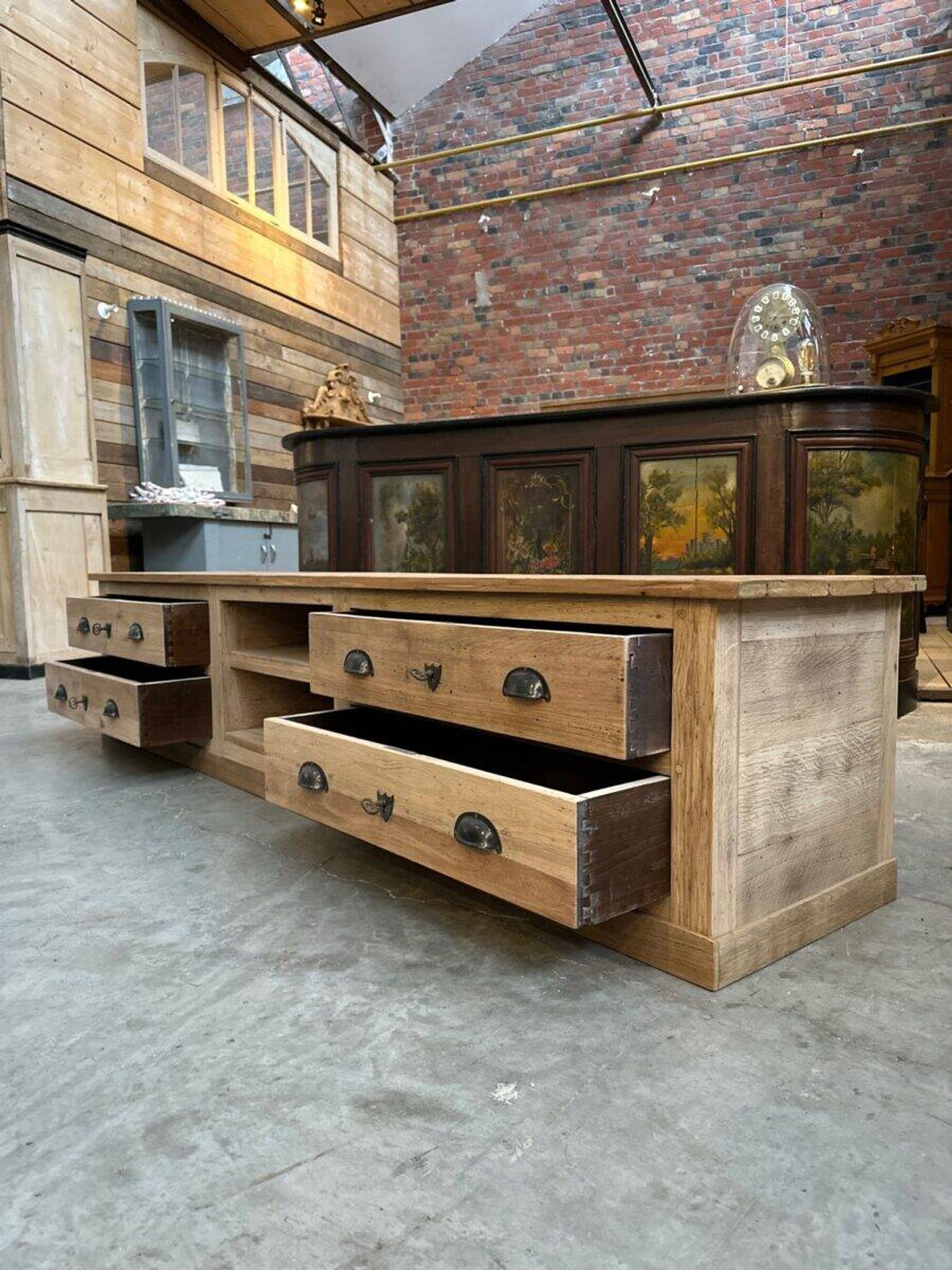 An old piece of workshop furniture transformed into a TV stand