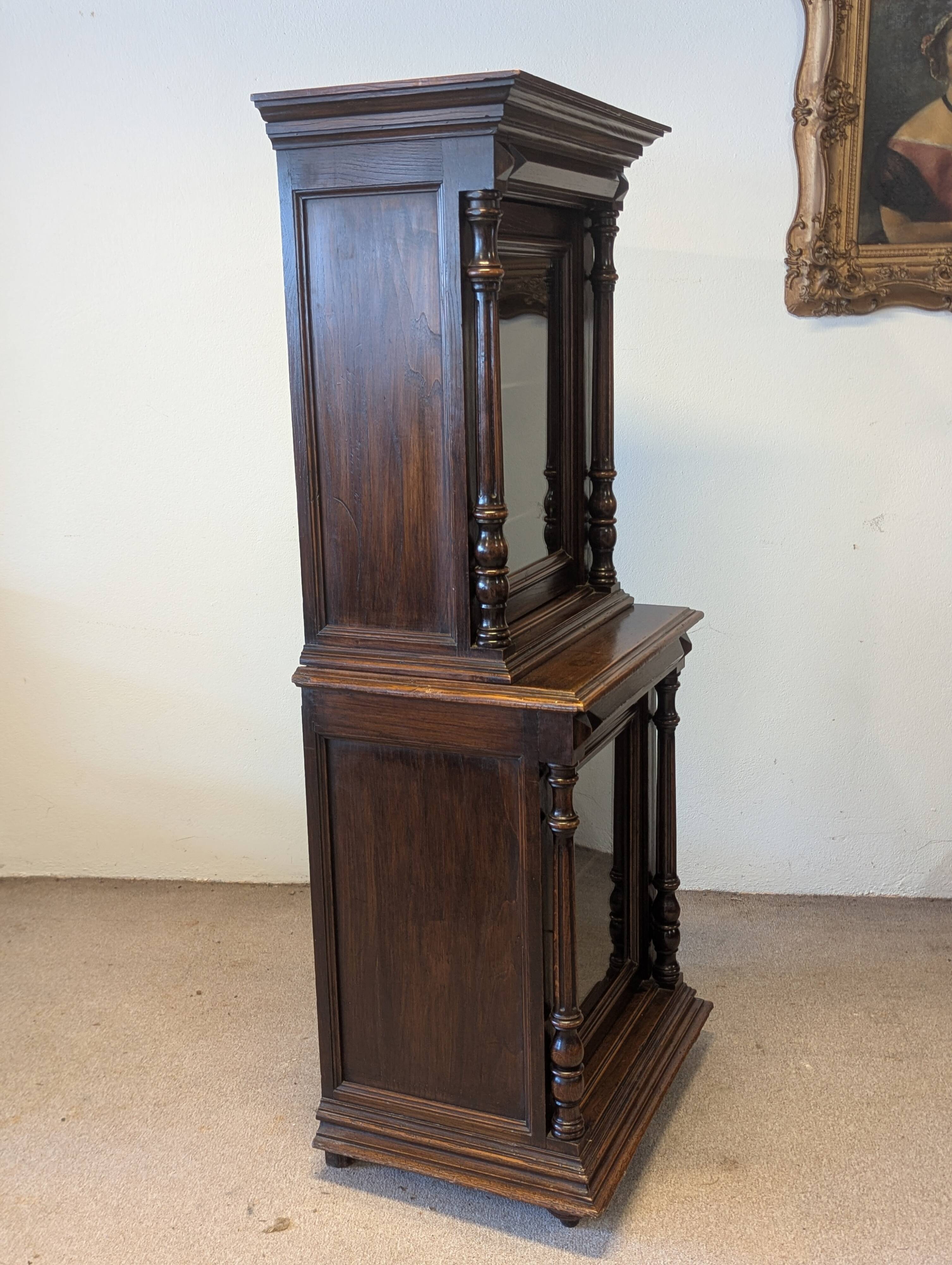 Two-body display cabinet in oak, Henri II style.