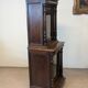 Two-body display cabinet in oak, Henri II style.