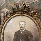 Old ancestor portrait in a gilded oval frame with Louis XVI style knot decoration