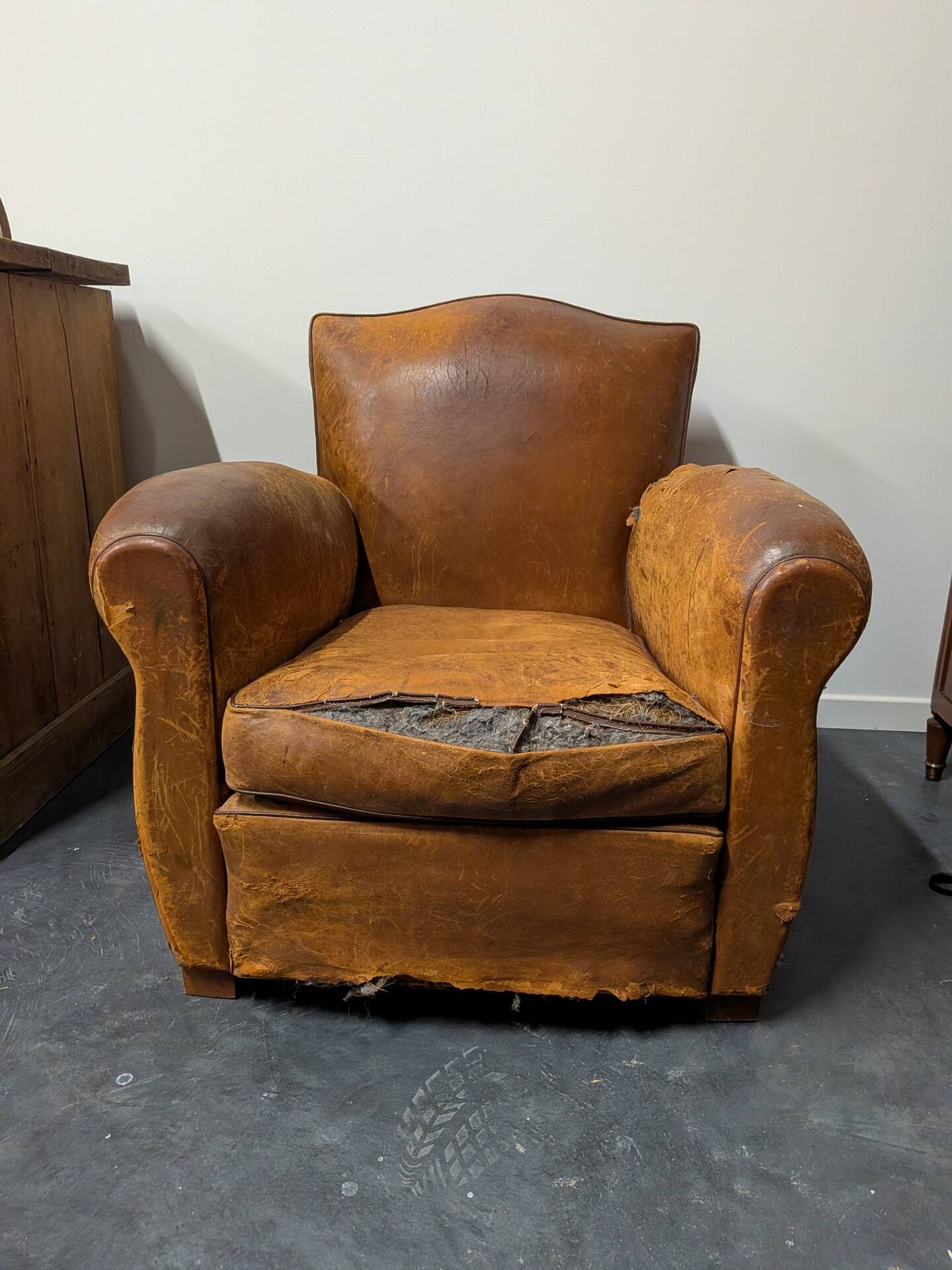 Pair of moustache club armchairs in leather, France, 1930s — to be restored.