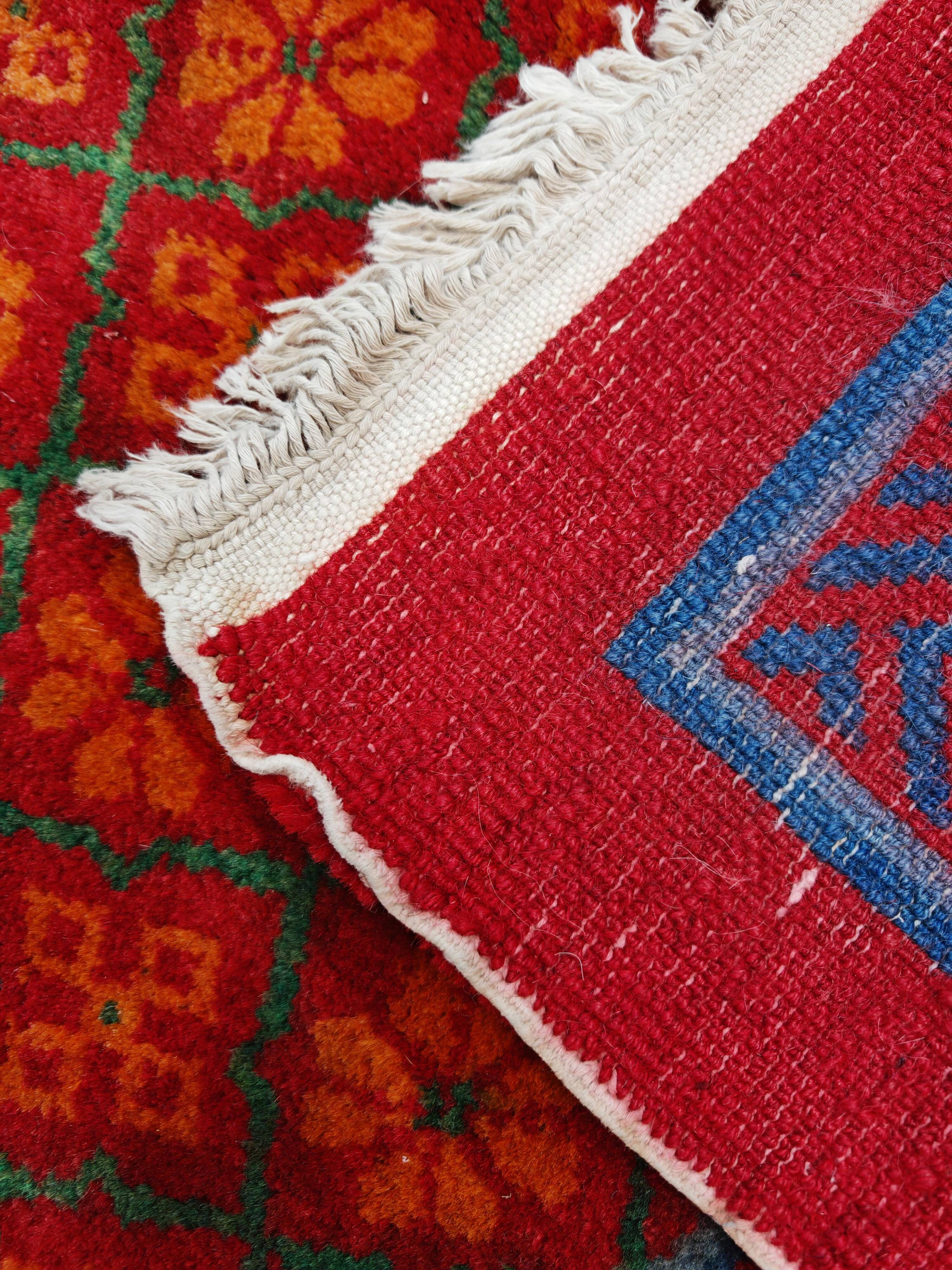 Ancient Khotan carpet, hand-knotted, floral pattern, Turkestan, 1960s.