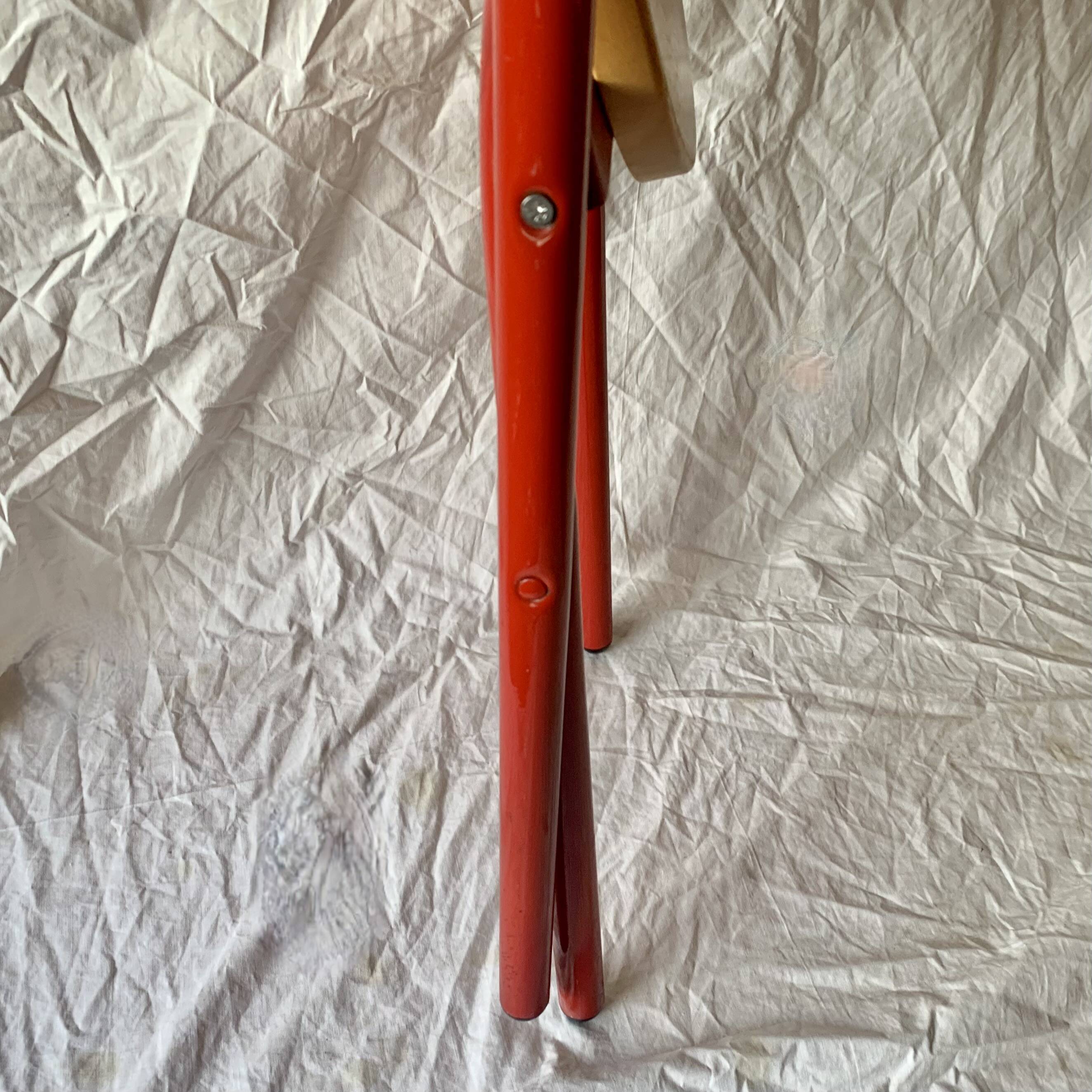 Vintage folding chair in red painted metal and wood