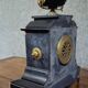 Large notary clock in black marble and gilded bronze.
