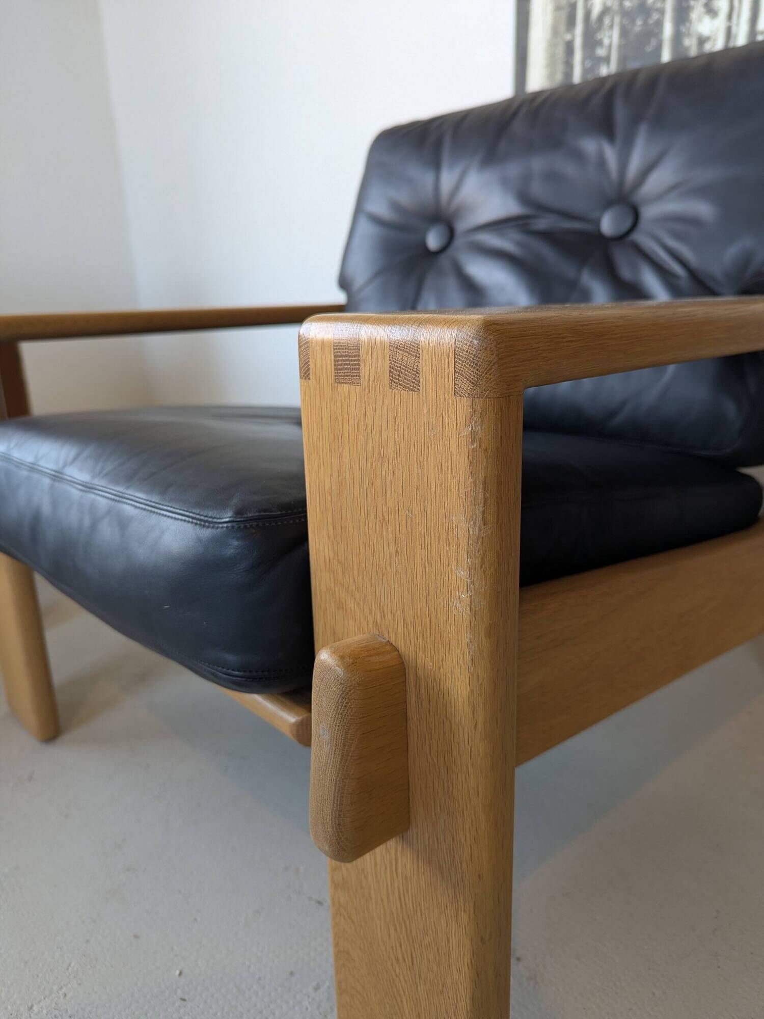 Pair of raw oak and leather armchairs by Esko Pajamies for Asko, Finland.