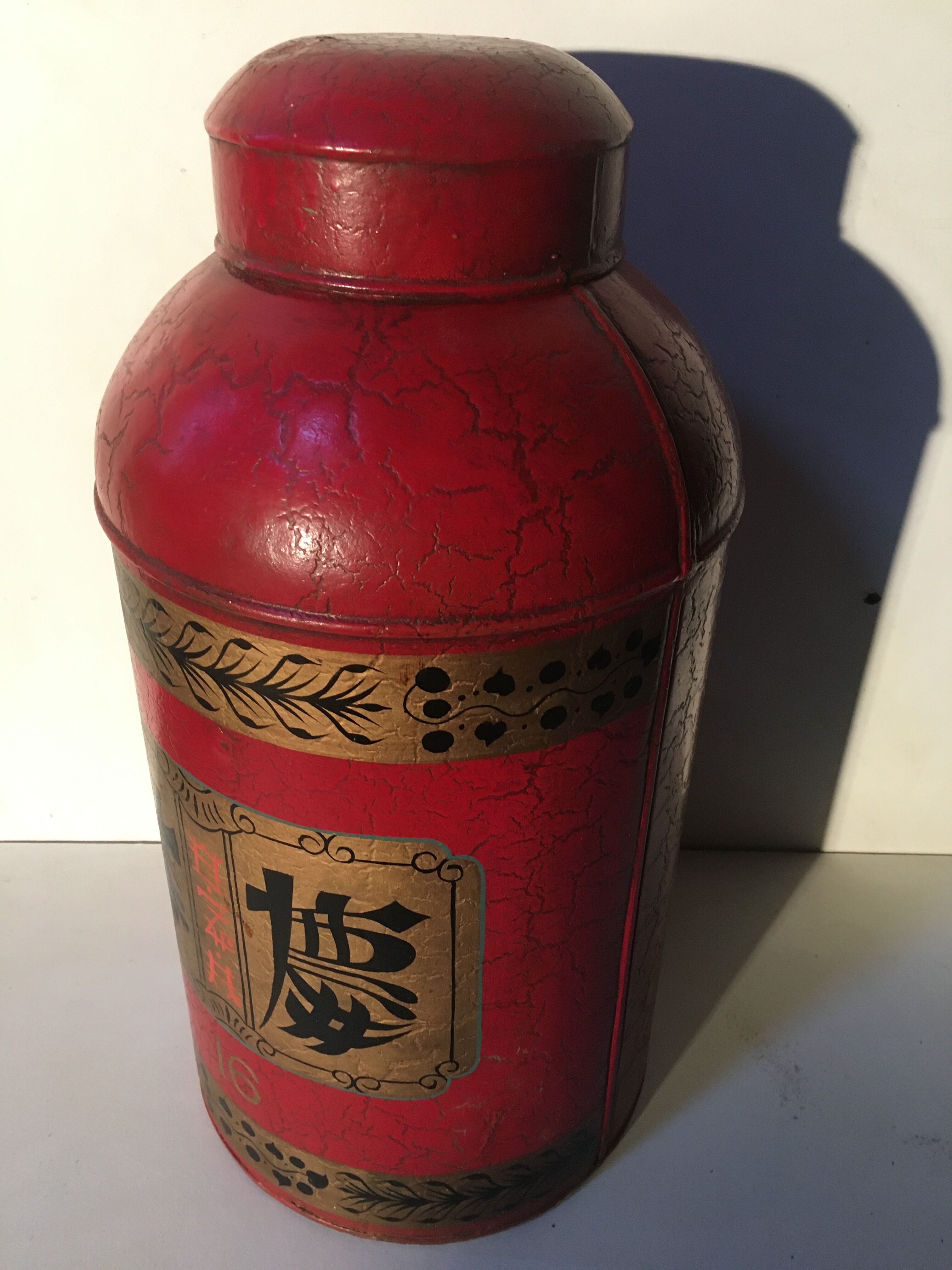 Asian red metal pot with lid
