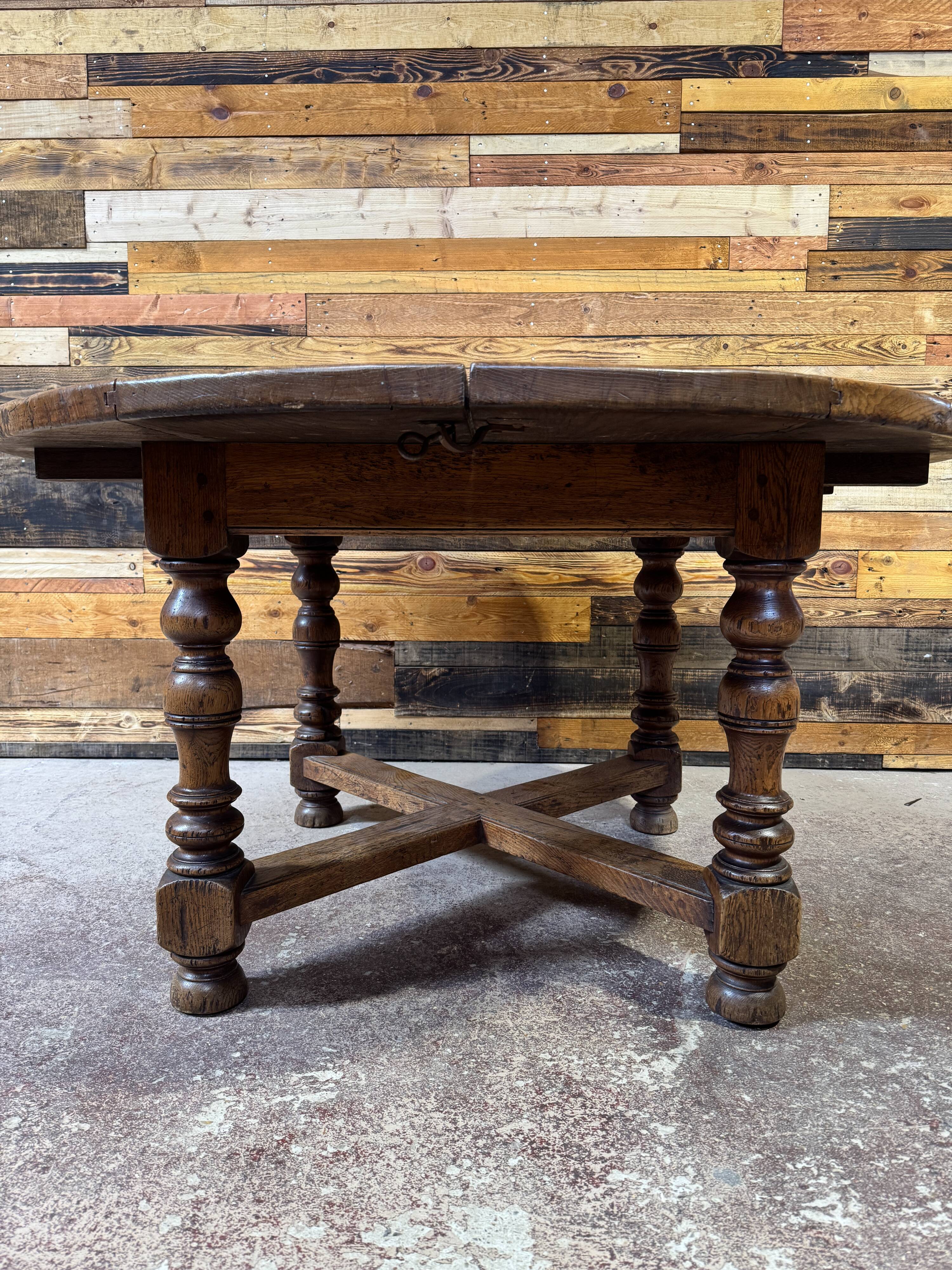 Antique oak round table with extensions, beautifully made from the years.