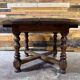 Antique oak round table with extensions, beautifully made from the years.