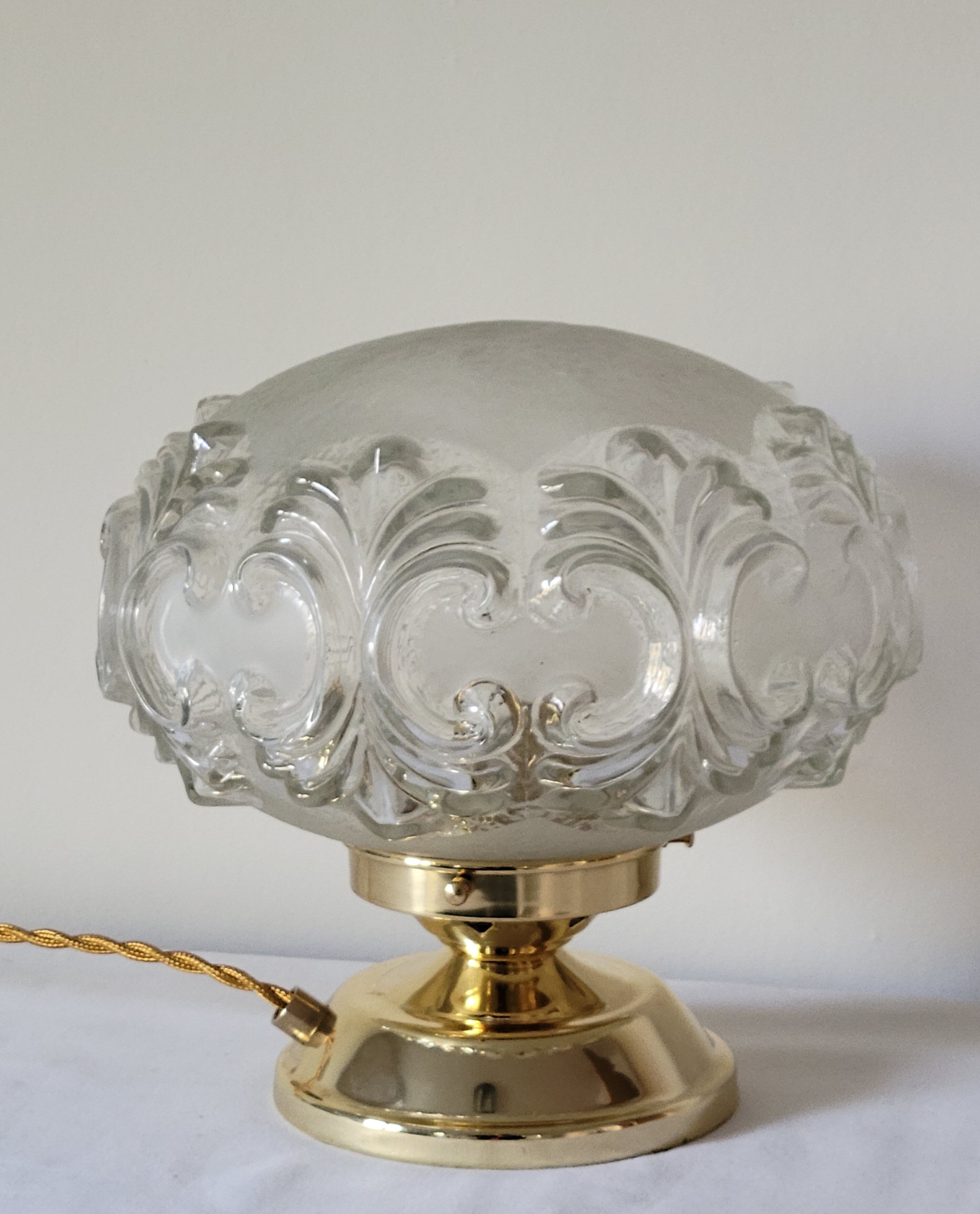 Brass lamp with molded glass globe