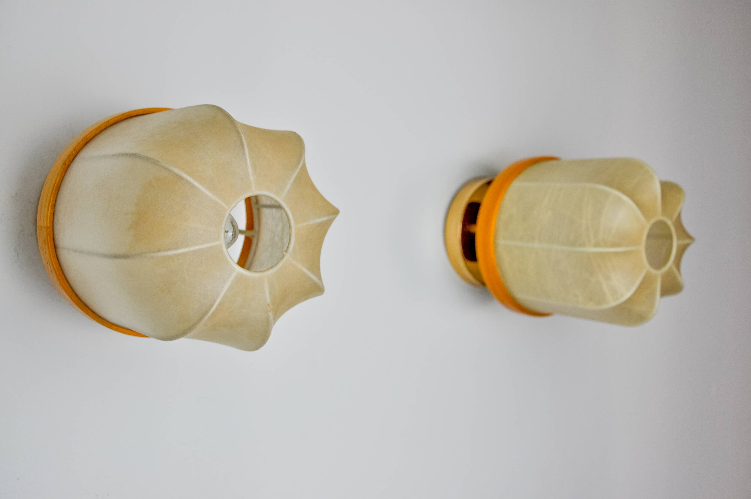 Pair of "cocoon" wall lights, polymer and pine, Italy, 1970