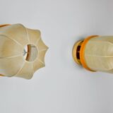 Pair of "cocoon" wall lights, polymer and pine, Italy, 1970