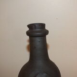 Old terracotta bottle with small spout
