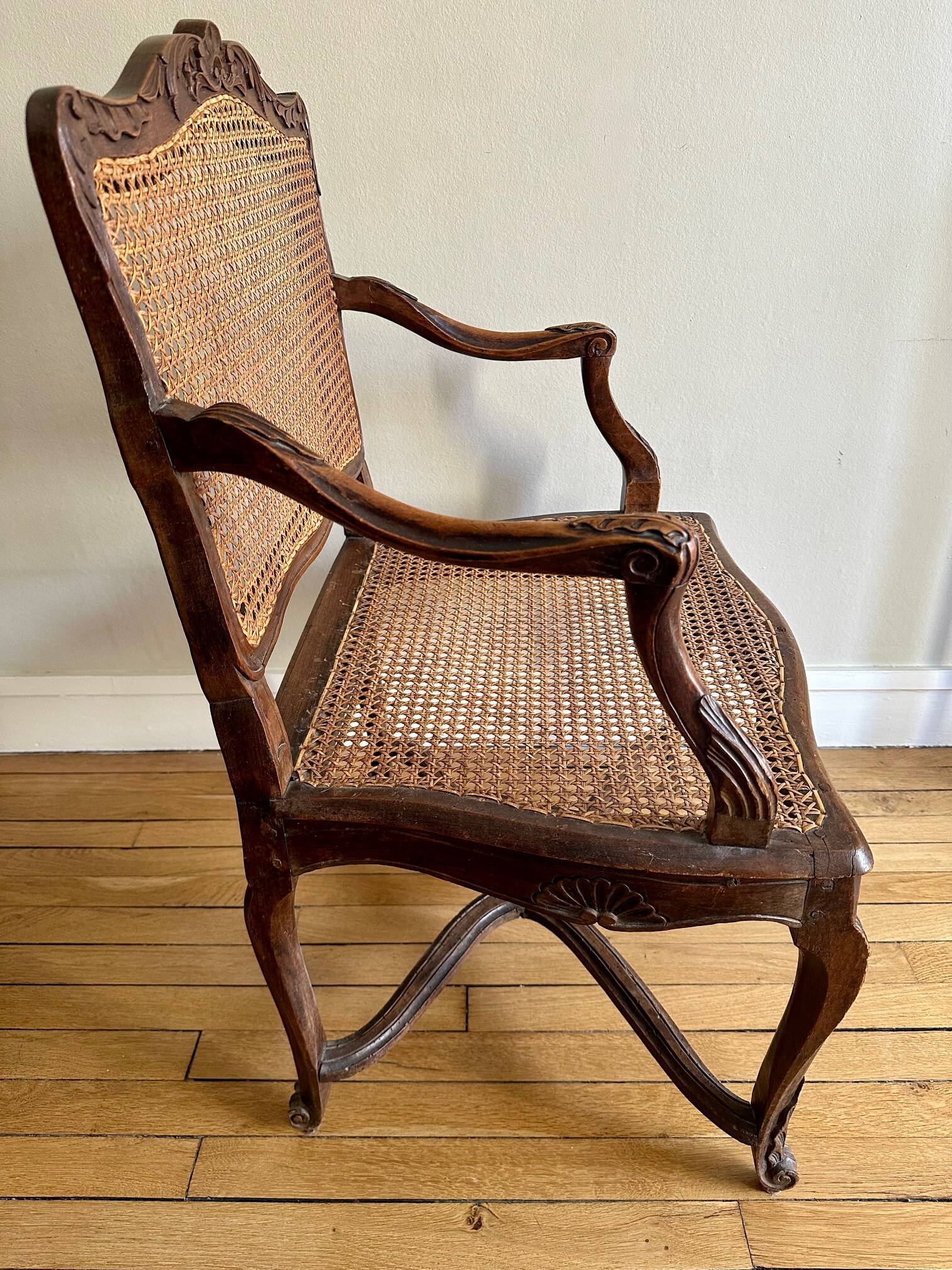 A pair of Regency armchairs with a stretcher.