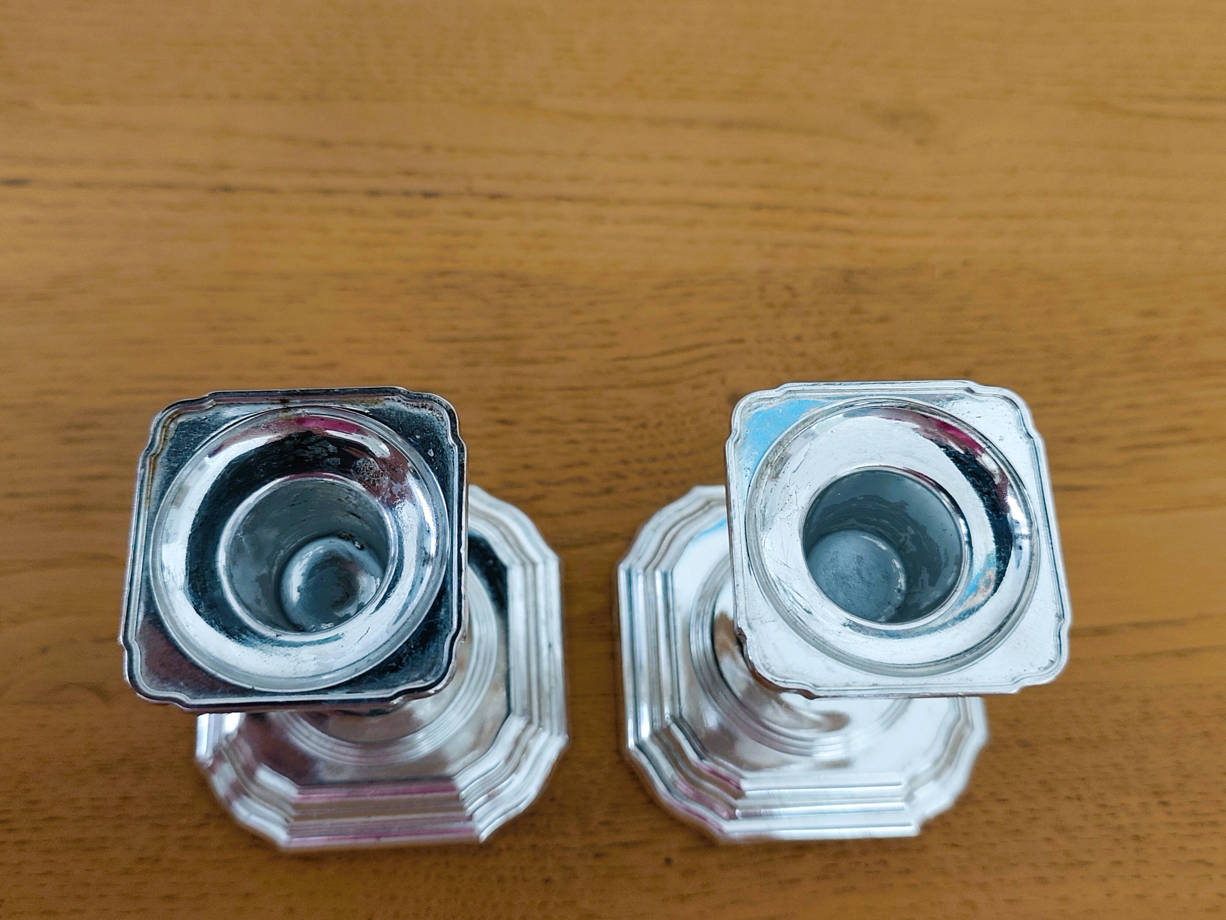 Pair of antique silver-plated candlesticks