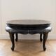Asian coffee table in Chinese style made of black and gold lacquered wood.