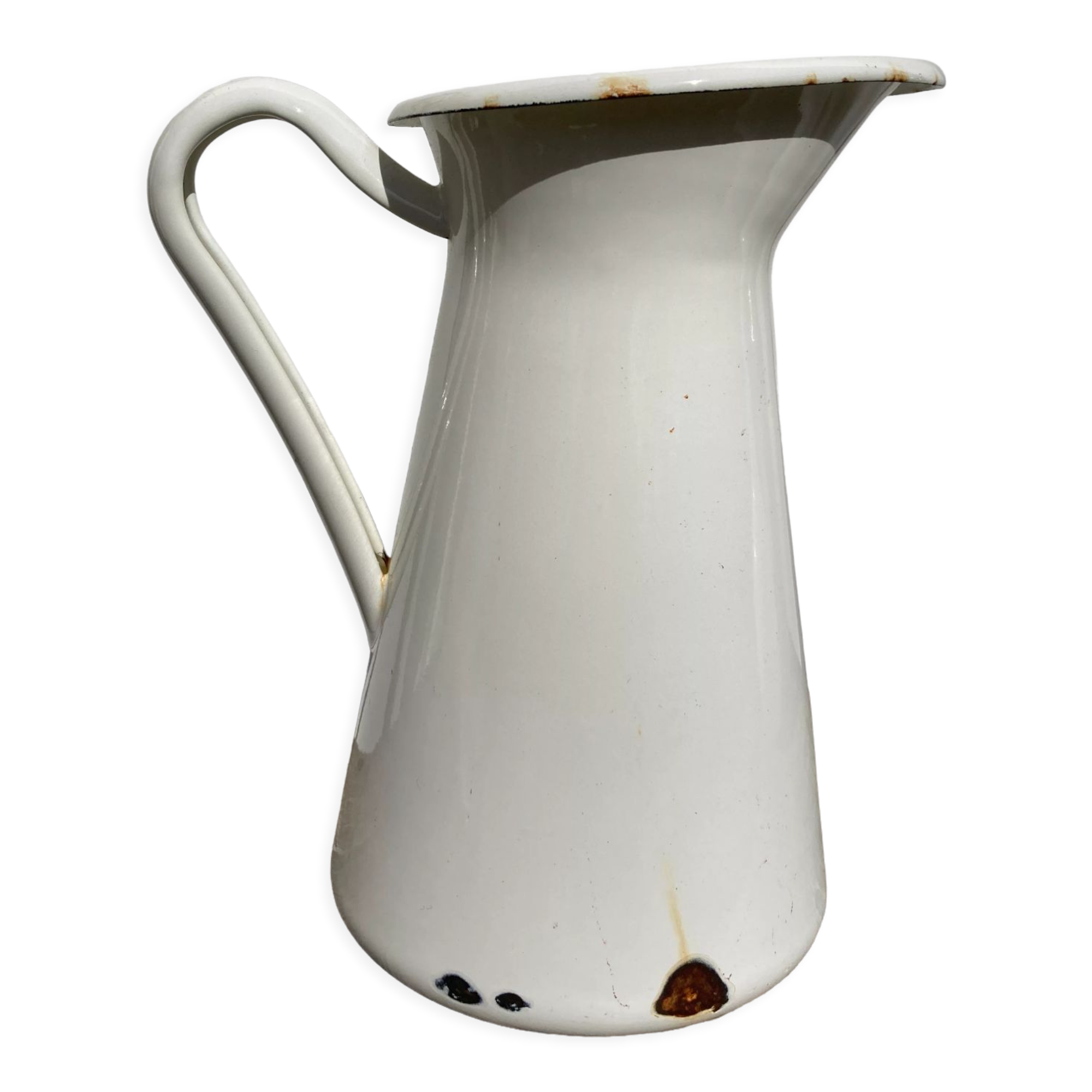 Old white enamelled metal pitcher