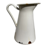 Old white enamelled metal pitcher