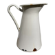 Old white enamelled metal pitcher