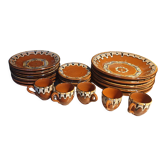 Terracotta service decorated with psychedelic drips