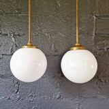 Pair of Art Deco pendant lights in brass and white opaline, 1920-30