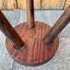 Wooden tripod stool.