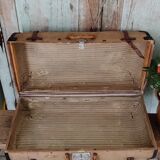 Old suitcase in canvas, wood and metal