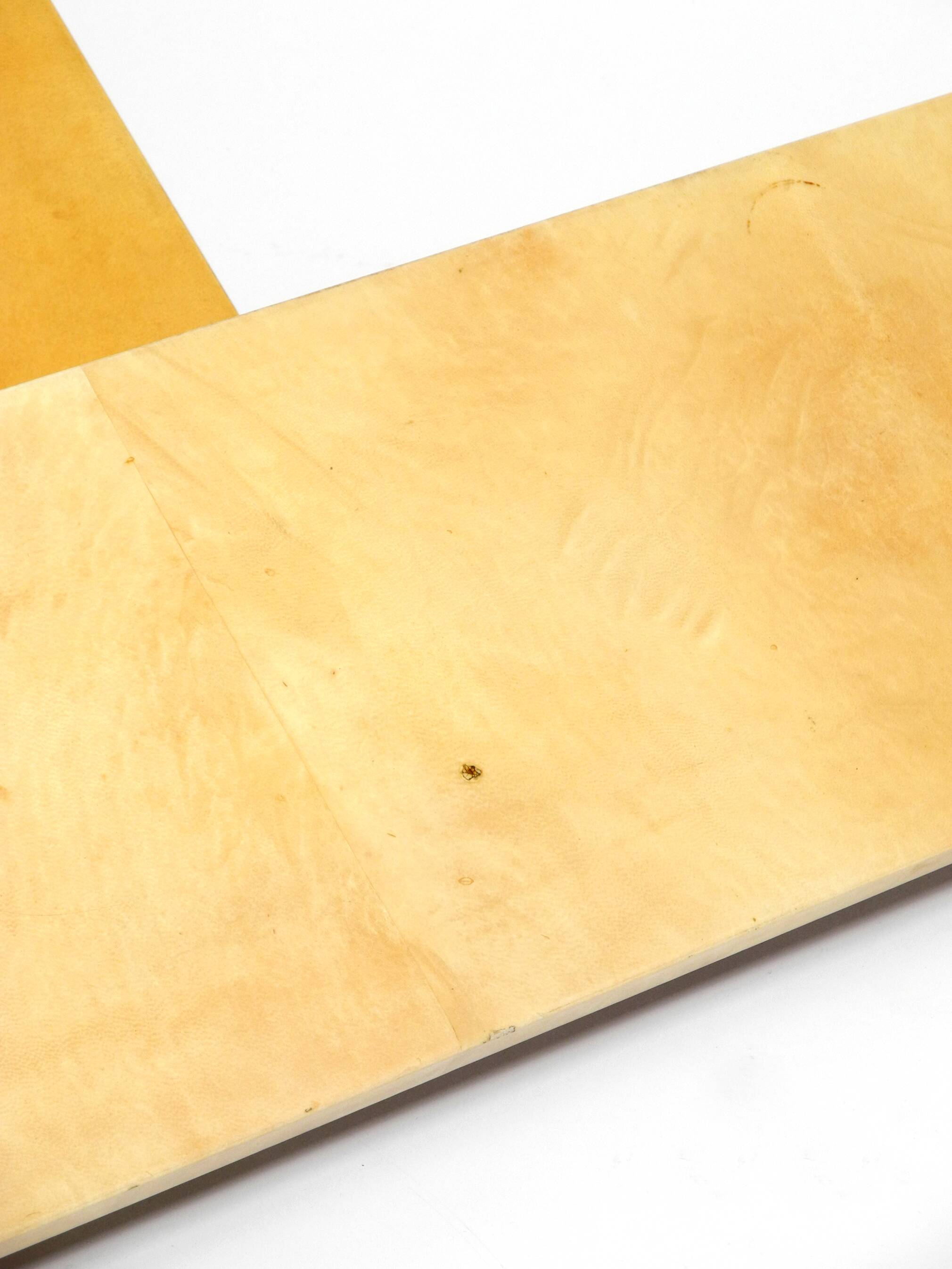 Two 1960s large Aldo Tura shelves made of wood and goatskin in beige