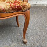 Louis XV armchair in carved solid wood and red and yellow fabric