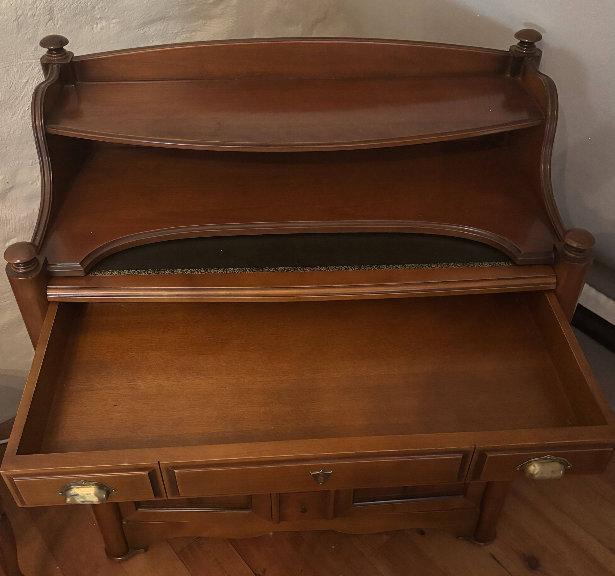 Vintage drop-leaf secretary with a green leather top and inlays.