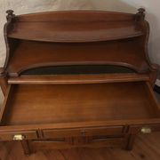 Vintage drop-leaf secretary with a green leather top and inlays.