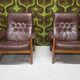 Pair of leather armchairs and an ottoman, Sweden 1970.
