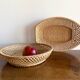 Pair of vintage braided rattan baskets