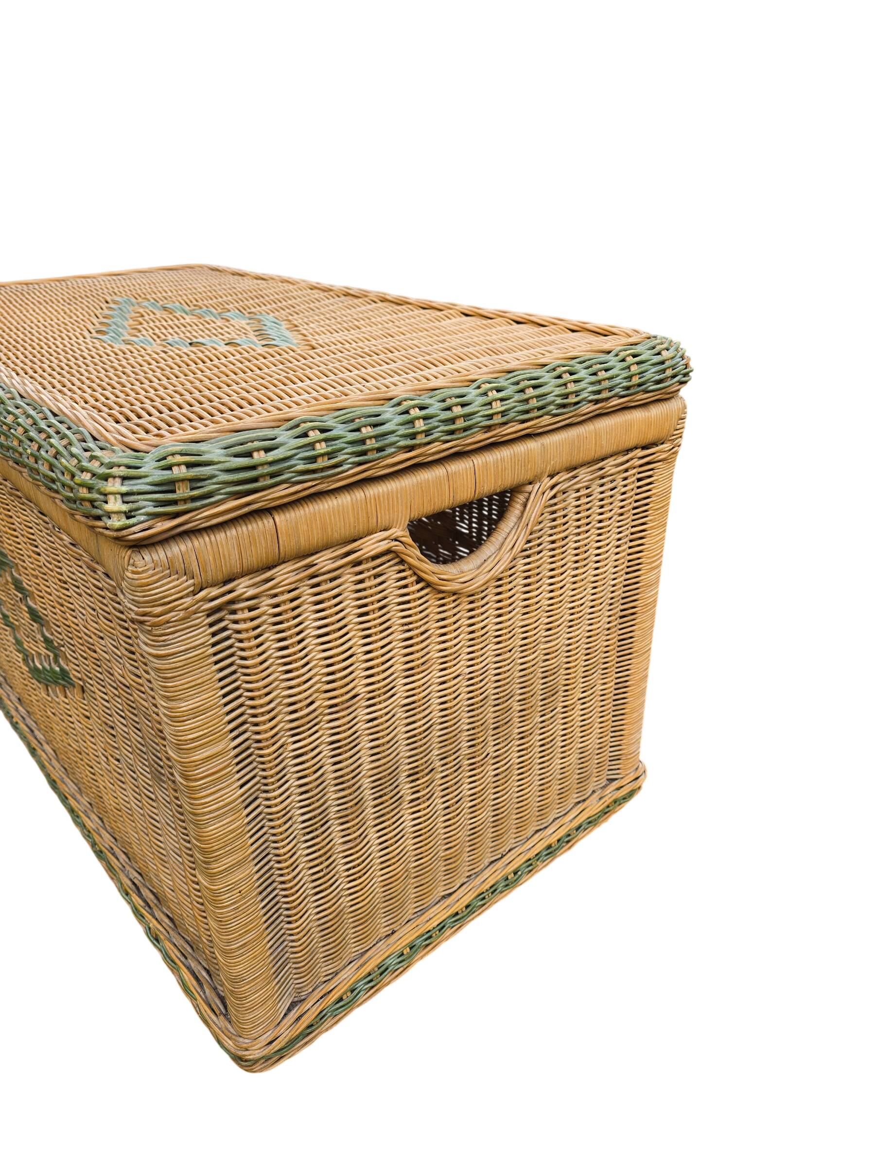 Large vintage wicker chest with green decoration.