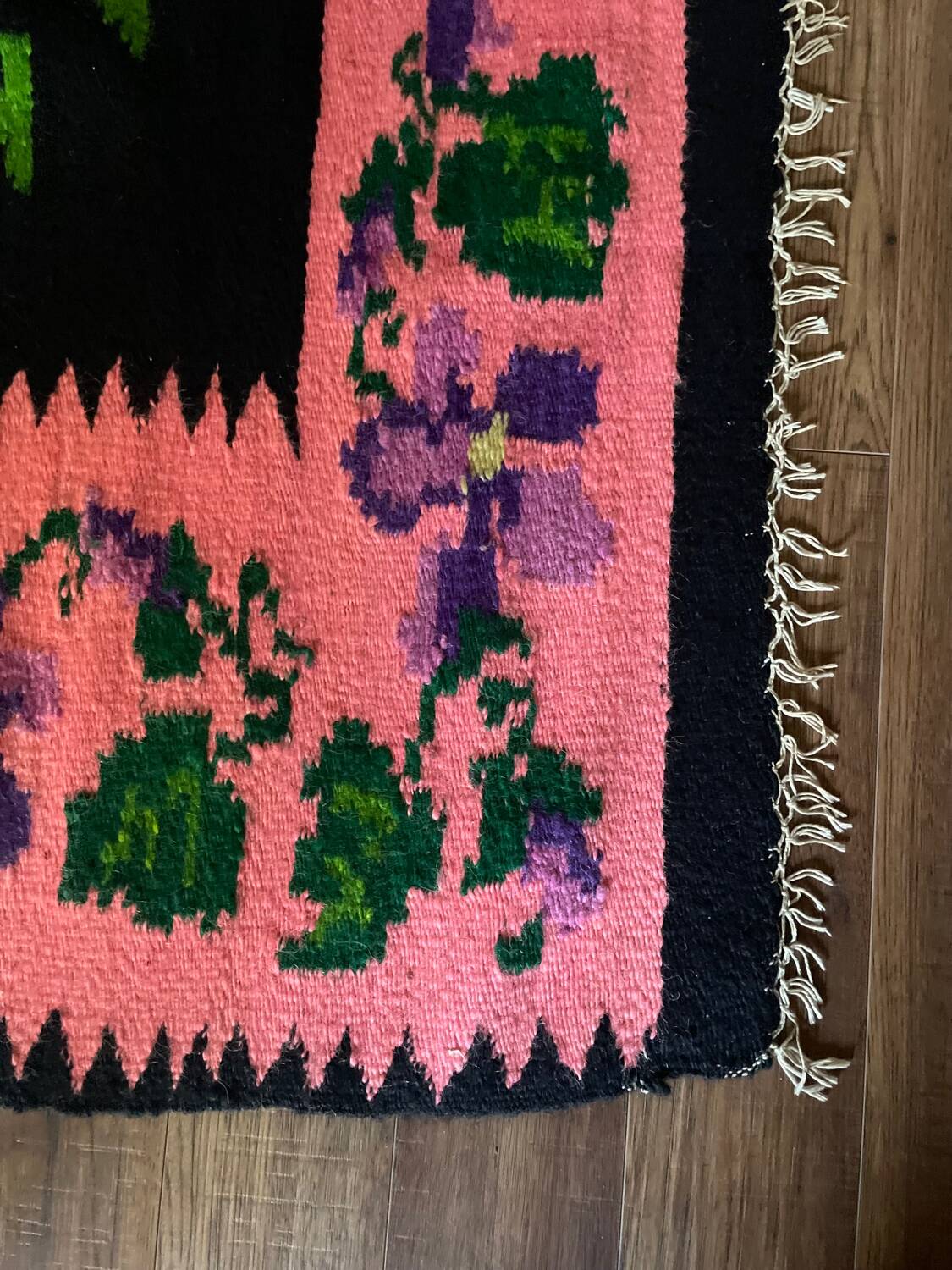 Oltenian floral rug handwoven in wool, purple flowers on black and pink background