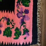 Oltenian floral rug handwoven in wool, purple flowers on black and pink background