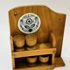Wall-mounted egg cup holder and wooden utensil holder.