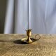 Small golden hand candlestick with a round loop handle D8 H6.5
