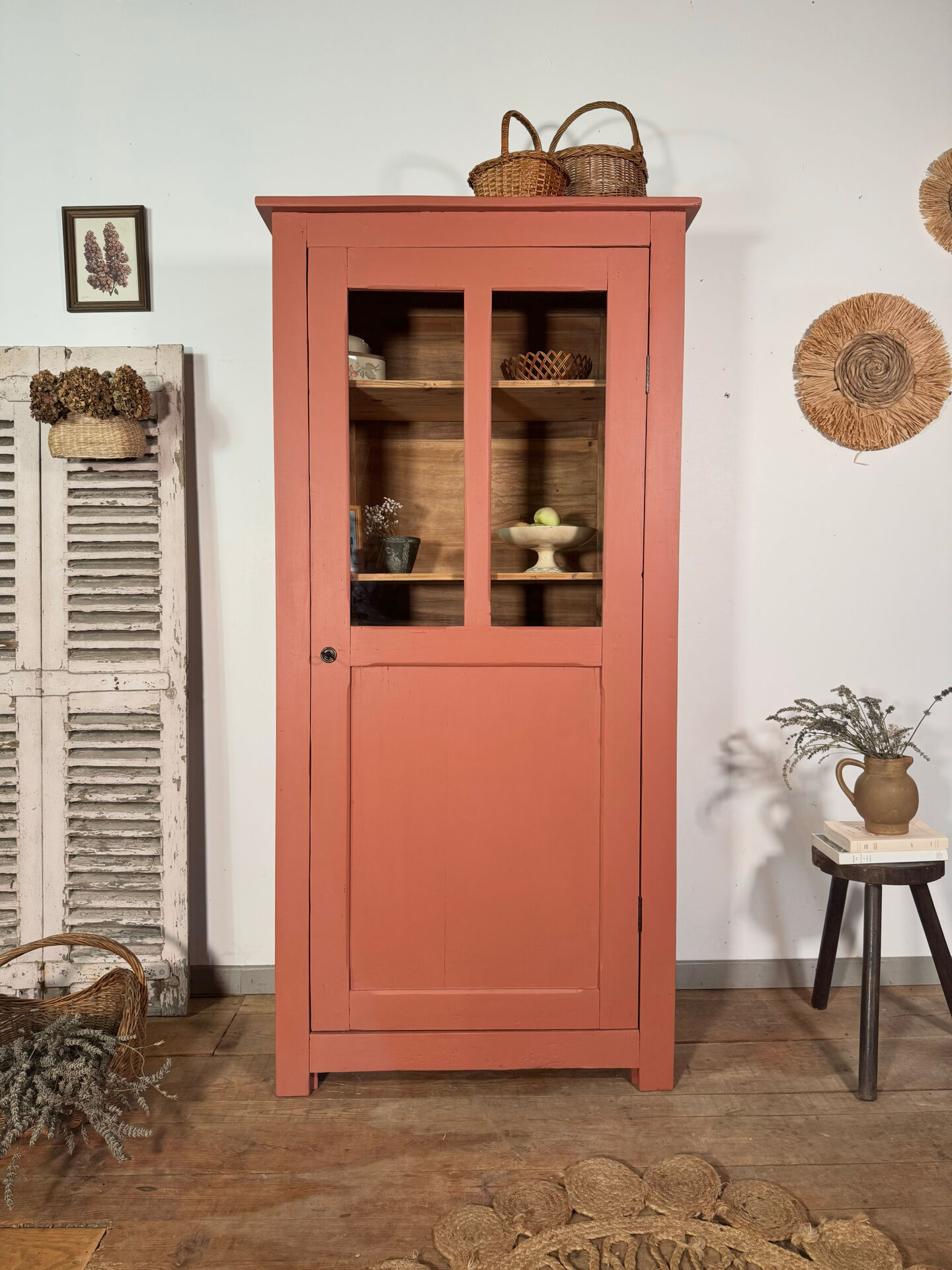 Antique glass-fronted terracotta cupboard