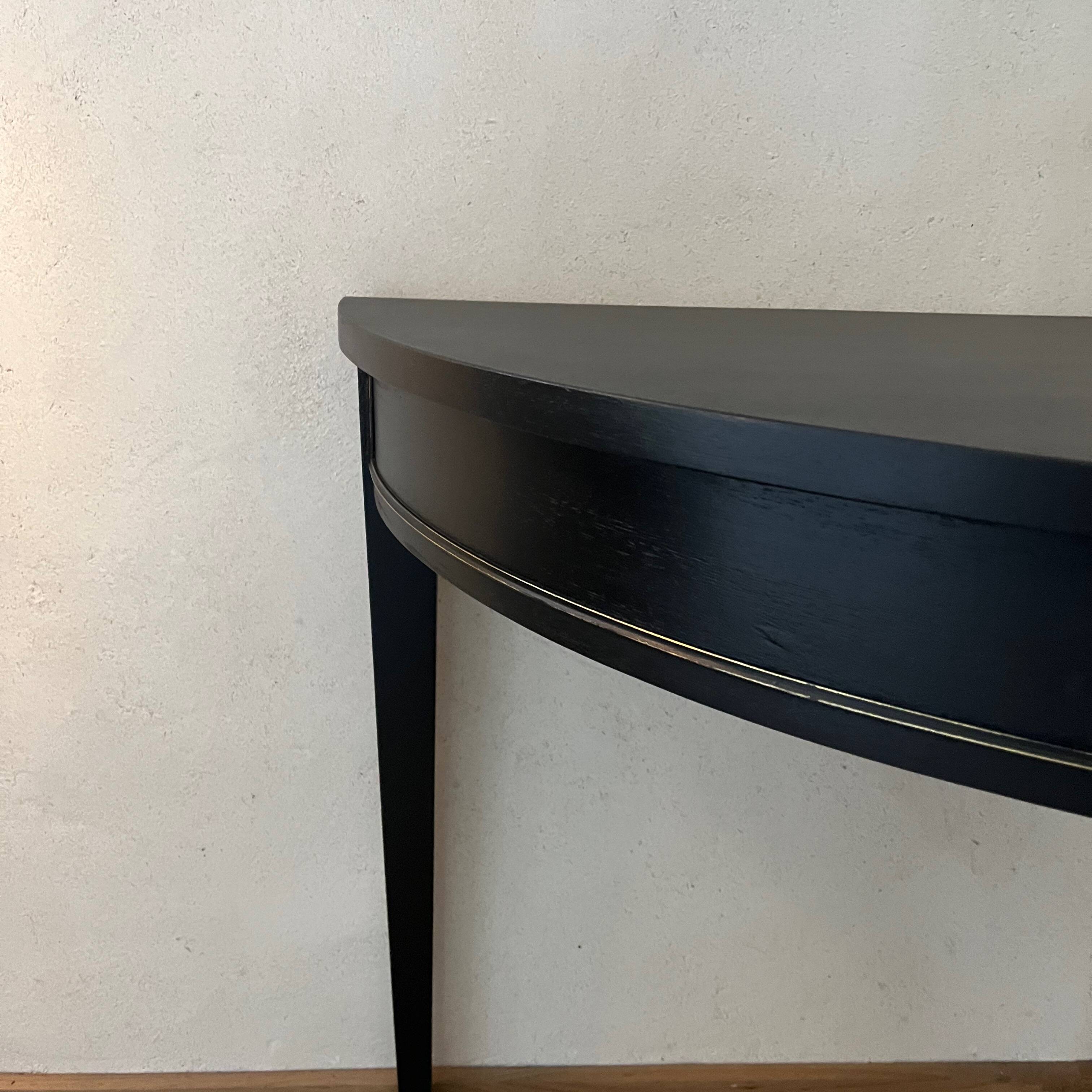 Black half-moon console