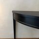 Black half-moon console