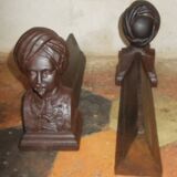 Old cast iron andirons with oriental decor
