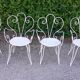 Salon de jardin 1 table 4 fauteuils en fer forgé blanc ancien.