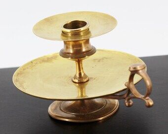 Brass hand candle holder
